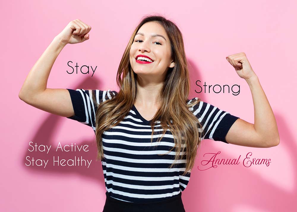 Powerful young woman on a pink background