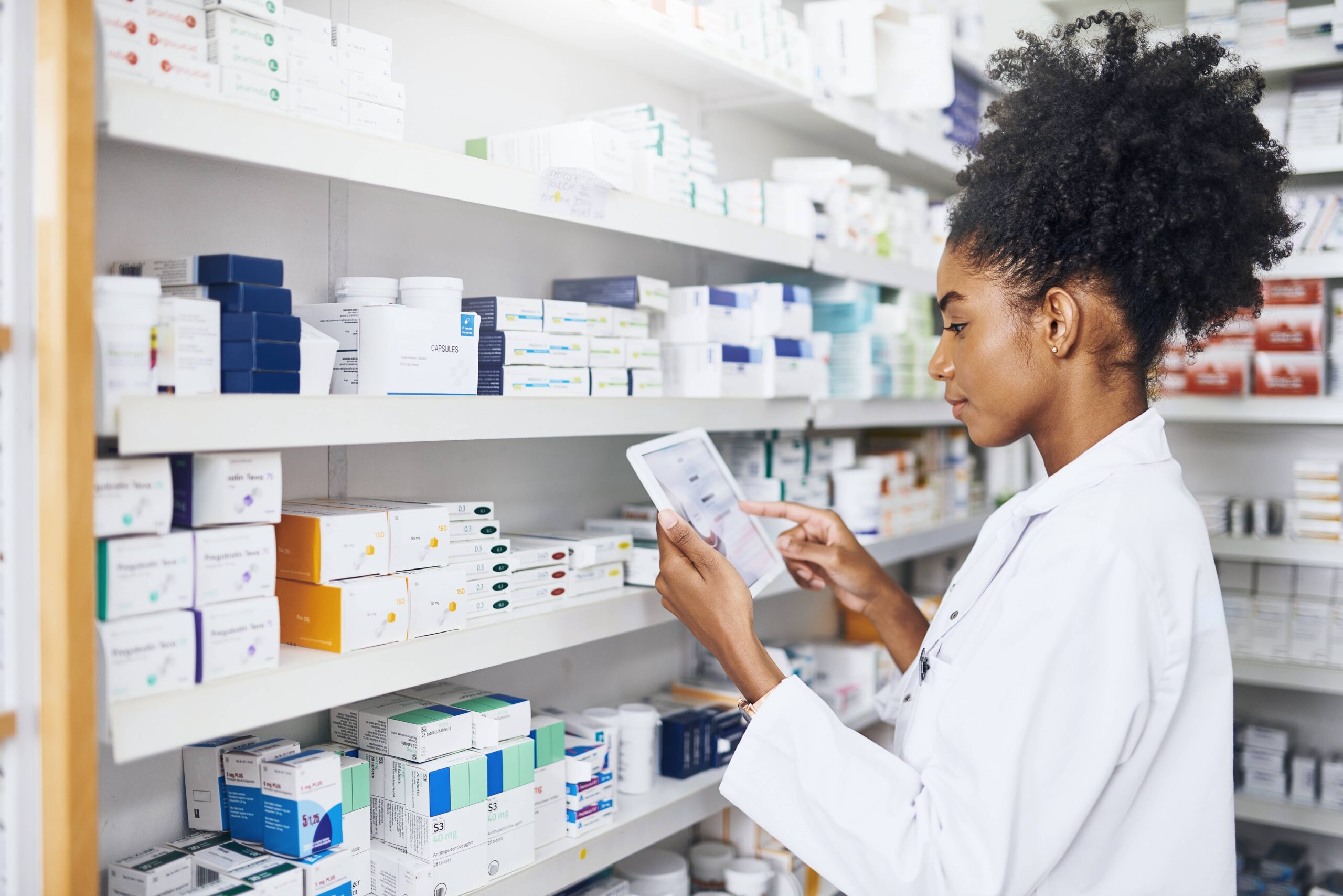 Woman, hands or tablet with screen in pharmacy for stock inspection, report for medicine inventory