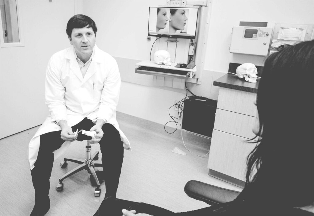 Samuel Bobek with patient - Seattle Wisdom Teeth