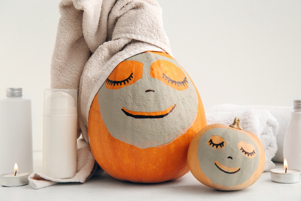 pumpkins with drawn faces or wearing clay masks