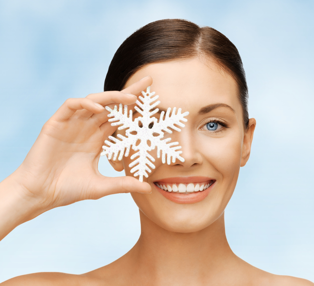 Bright picture of beautiful woman with snowflake