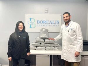 Assistant Manager, Jaehee Lee and Army Veteran Dr. Navin Arora at Borealis Dermatology with their generous donation.