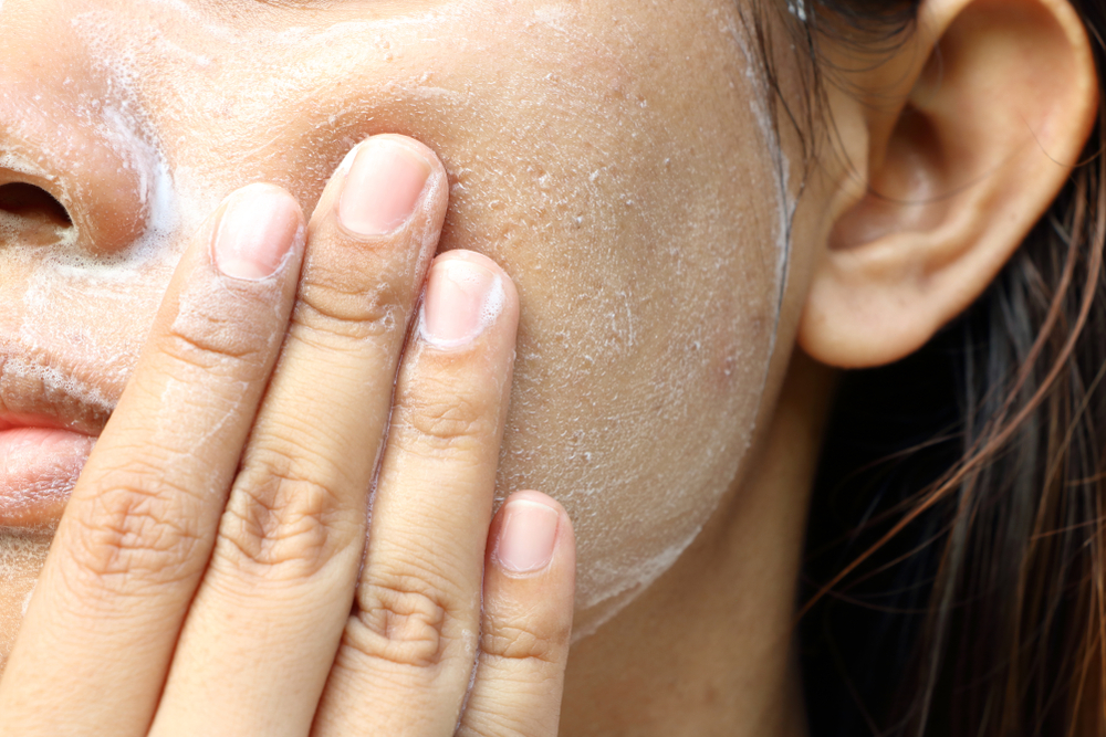 Close up Asia woman cheek. Woman washing face (have wide pores)