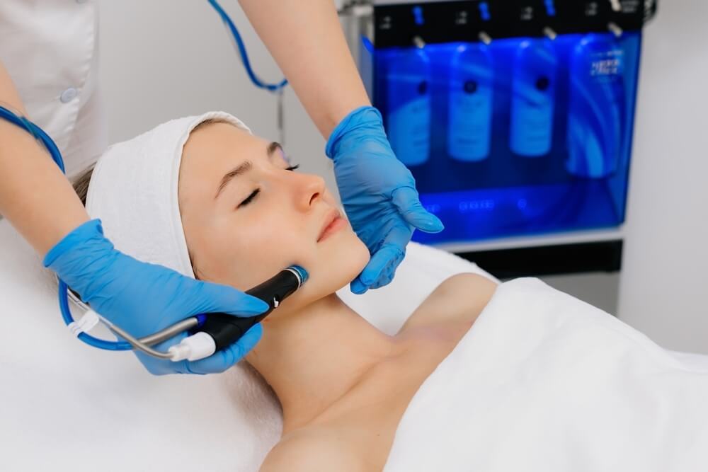 Facial skin care machine in spa clinic for anti-aging or acne treatment