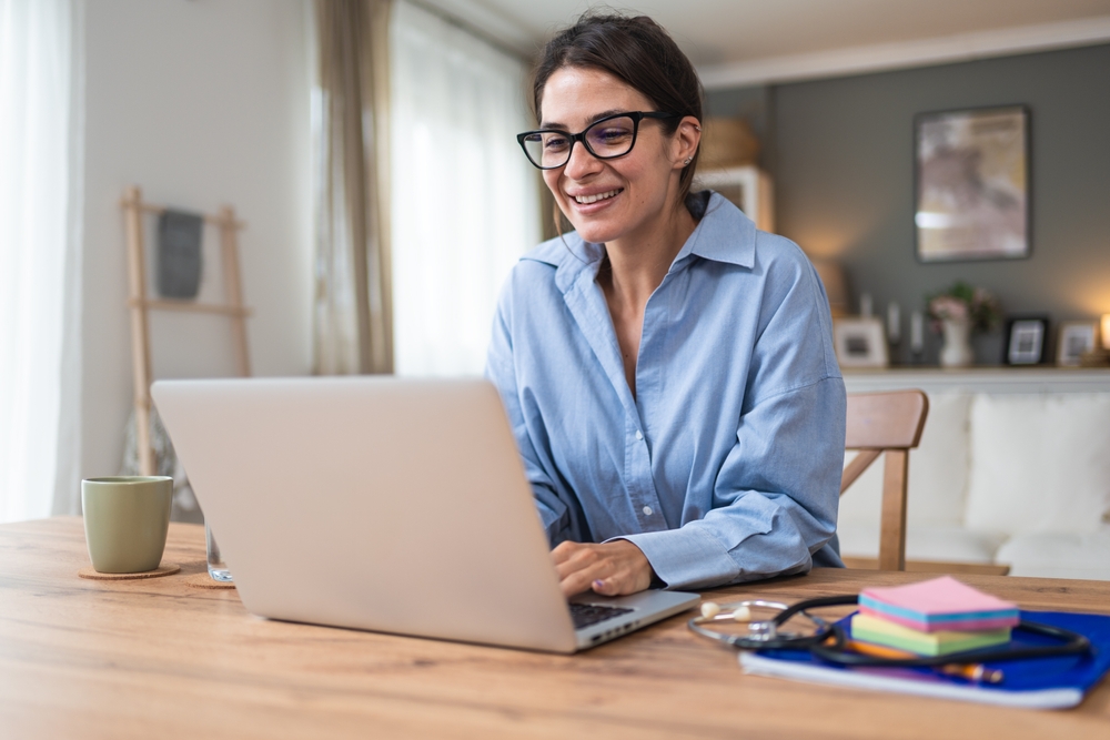 young woman doctor providing telemedicine services from a home office
