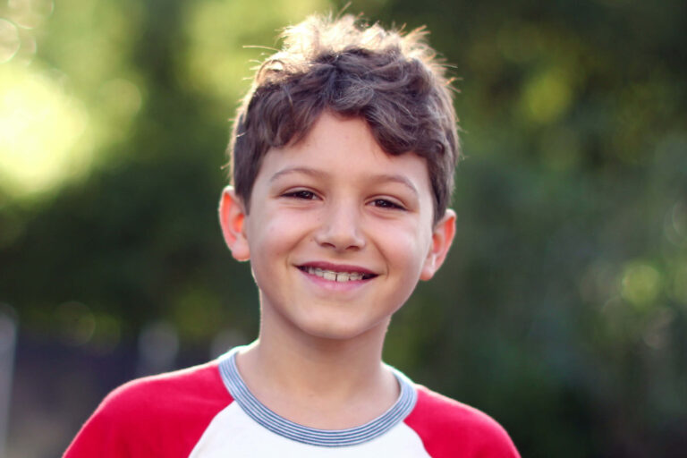 Dental retainers on the teeth of a young boy
