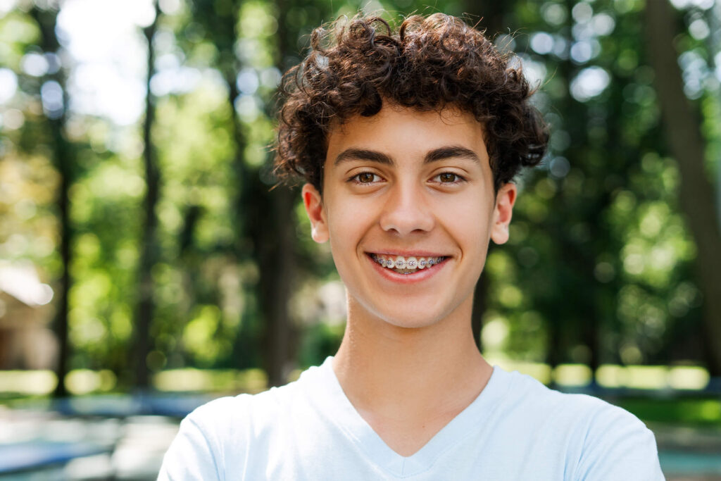 Dental braces on the teeth of a young teenage boy