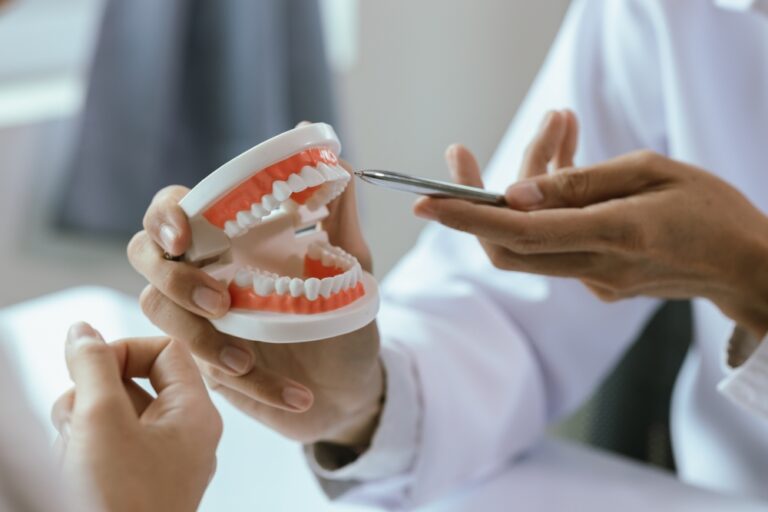 The dentist and patient will discuss oral health, including dentures and implants