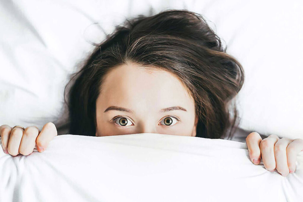 Half-faced blanket girl looking strangly