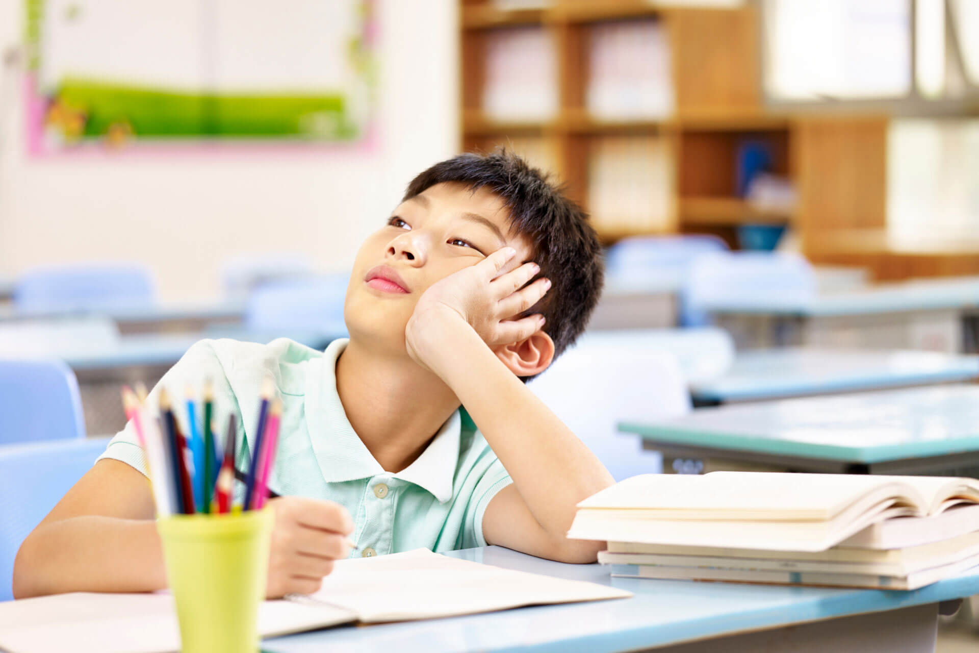 Boy thinking during class time.