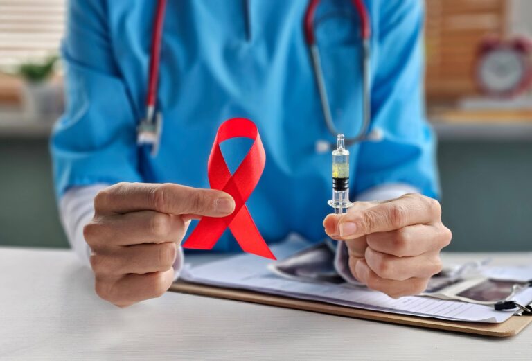 doctor with Red Ribbon for December World Aids Day