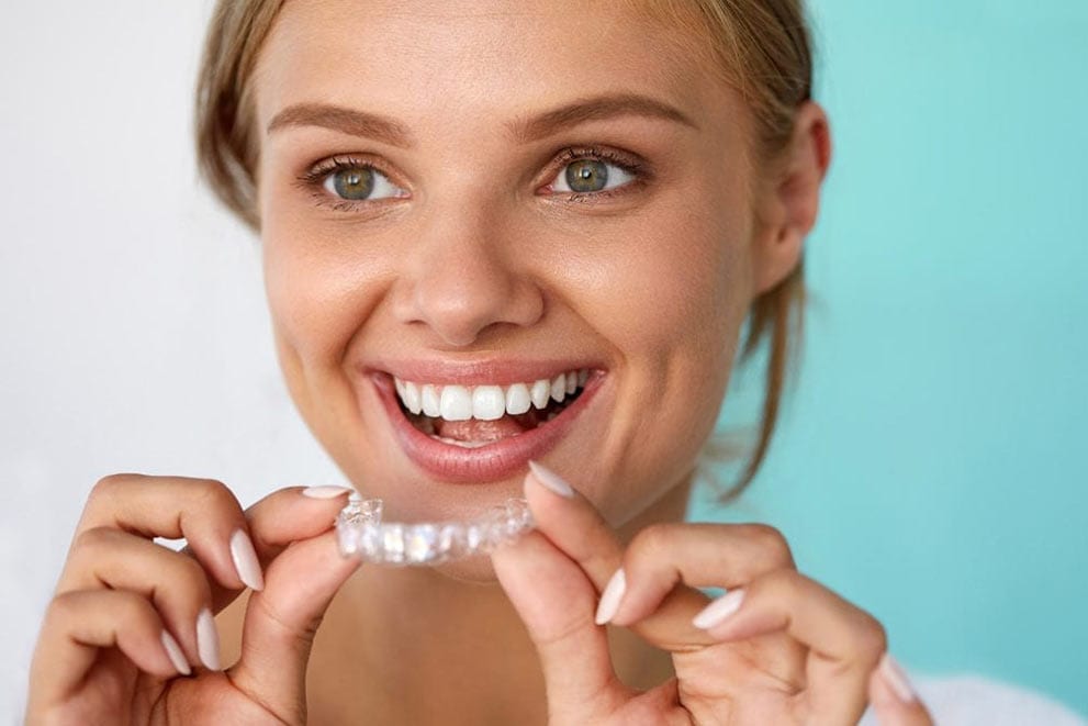 woman holding Invisalign