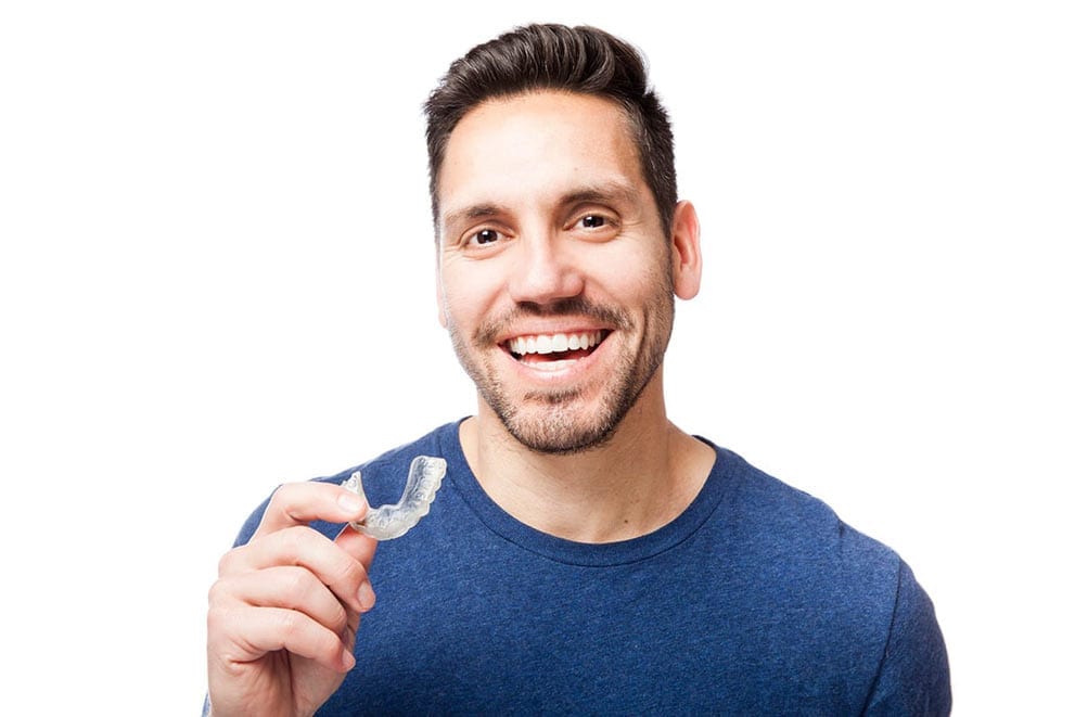 man holding Invisalign