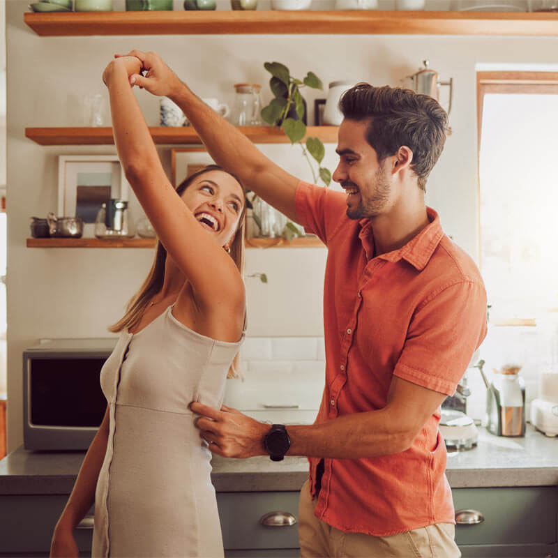 couple dancing in the kitchen