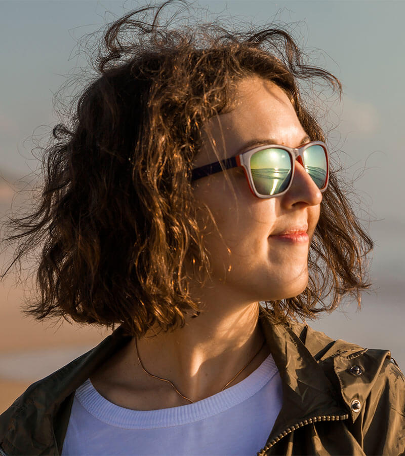 sideview of a woman wearing sunglasses