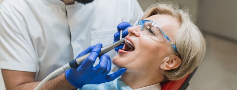 Male orthodontist checkup. Perfect ideal healthy smile. Stomatological dental equipment, dentist whitening filling tooth teeth of female patient at dental hospital