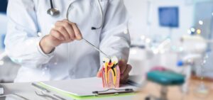 The dentist shows the spread of the disease and pulp formation on the table