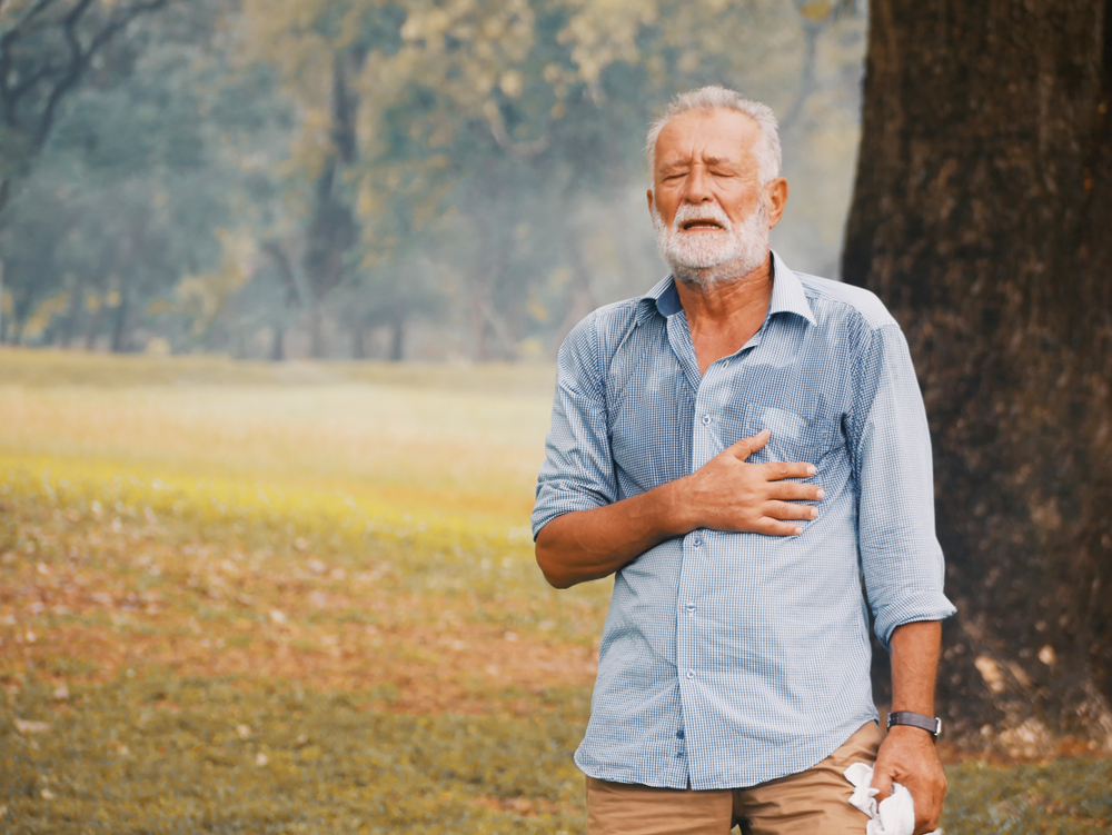 Elderly caucasian sweating and fainting