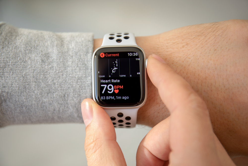 Man hand with Apple Watch Series 4 with Heart Rate on the screen