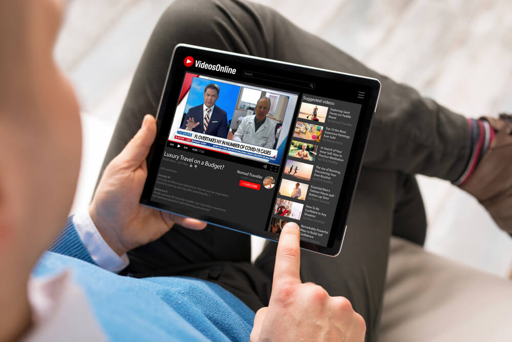Man watching online videos on tablet