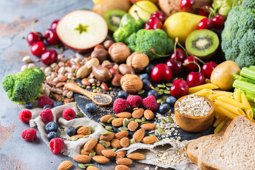 Selection of rich fiber sources vegan food. Vegetables fruit seeds beans