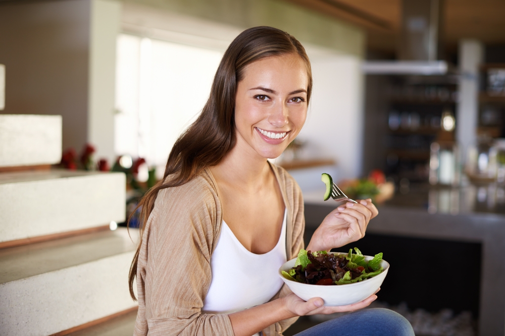 Salad, portrait and happy woman a house with breakfast, bowl or lettuce for balance, wellness or gut health at home. Vegetables, brunch or vegan