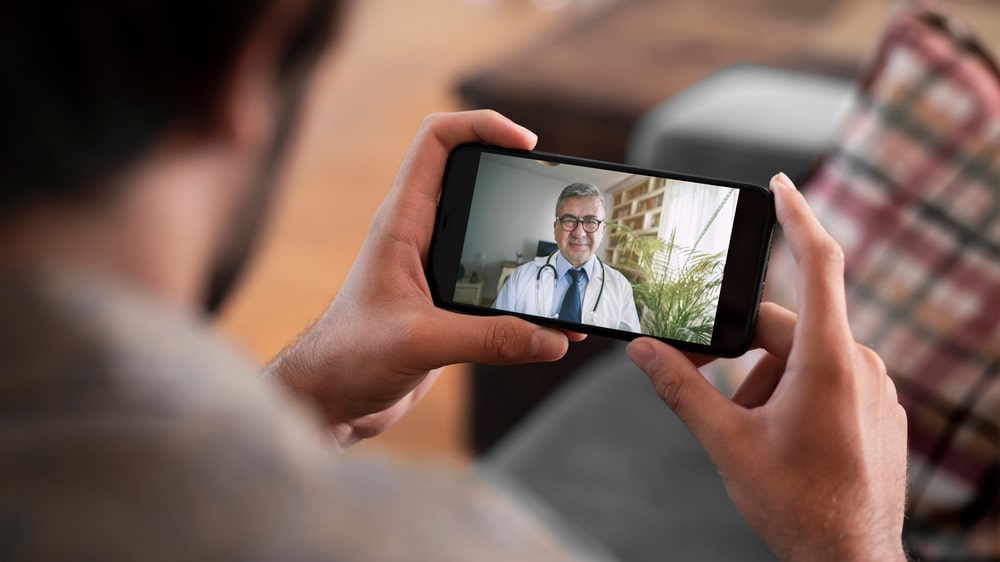 Doctor and patient talking on mobile phone