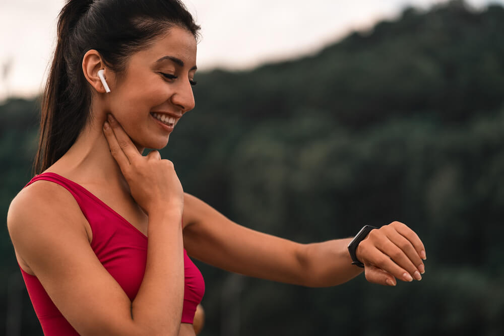 woman is measuring her heart rate