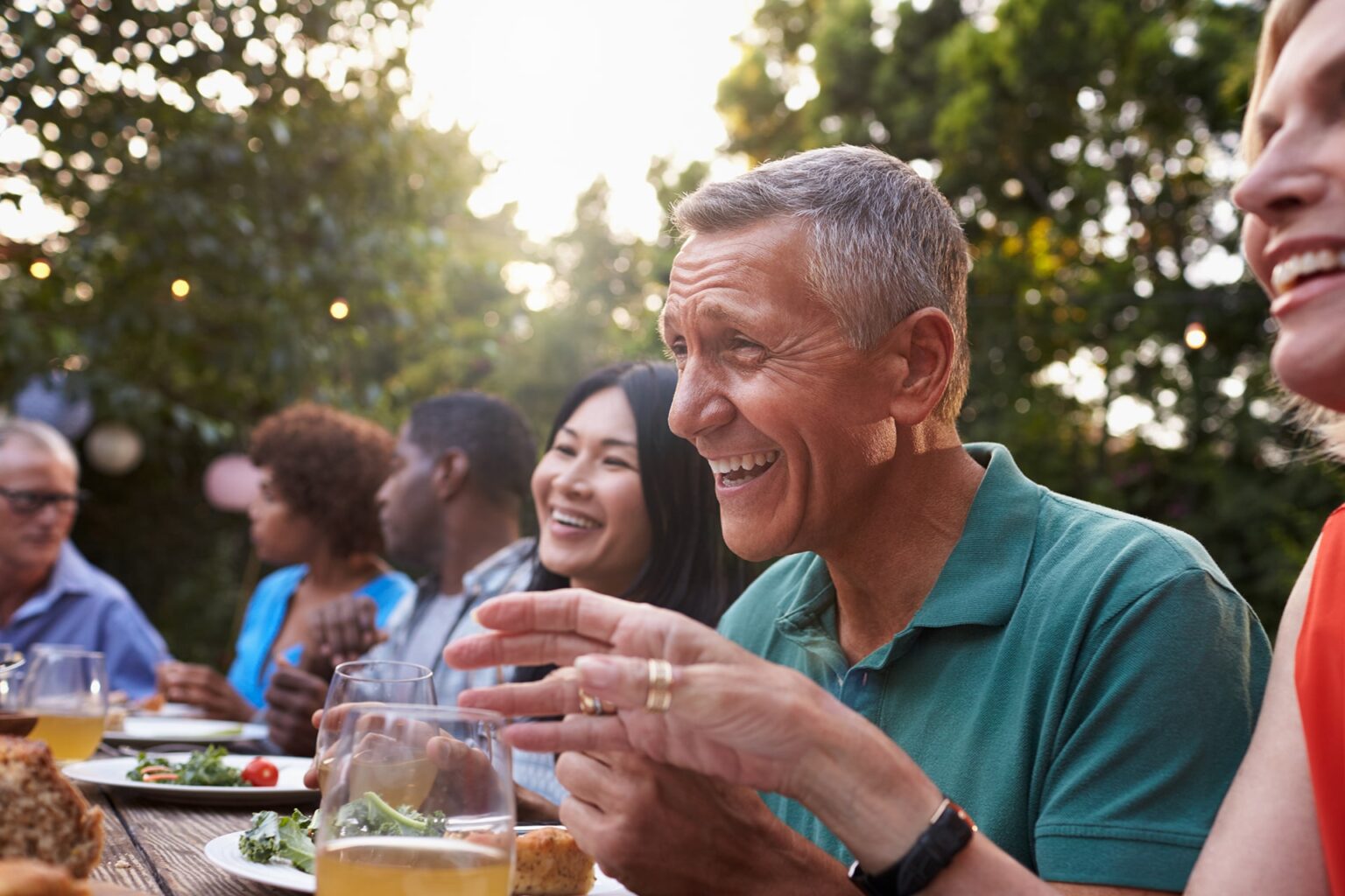 group of people enjoying a meal together outdoors
