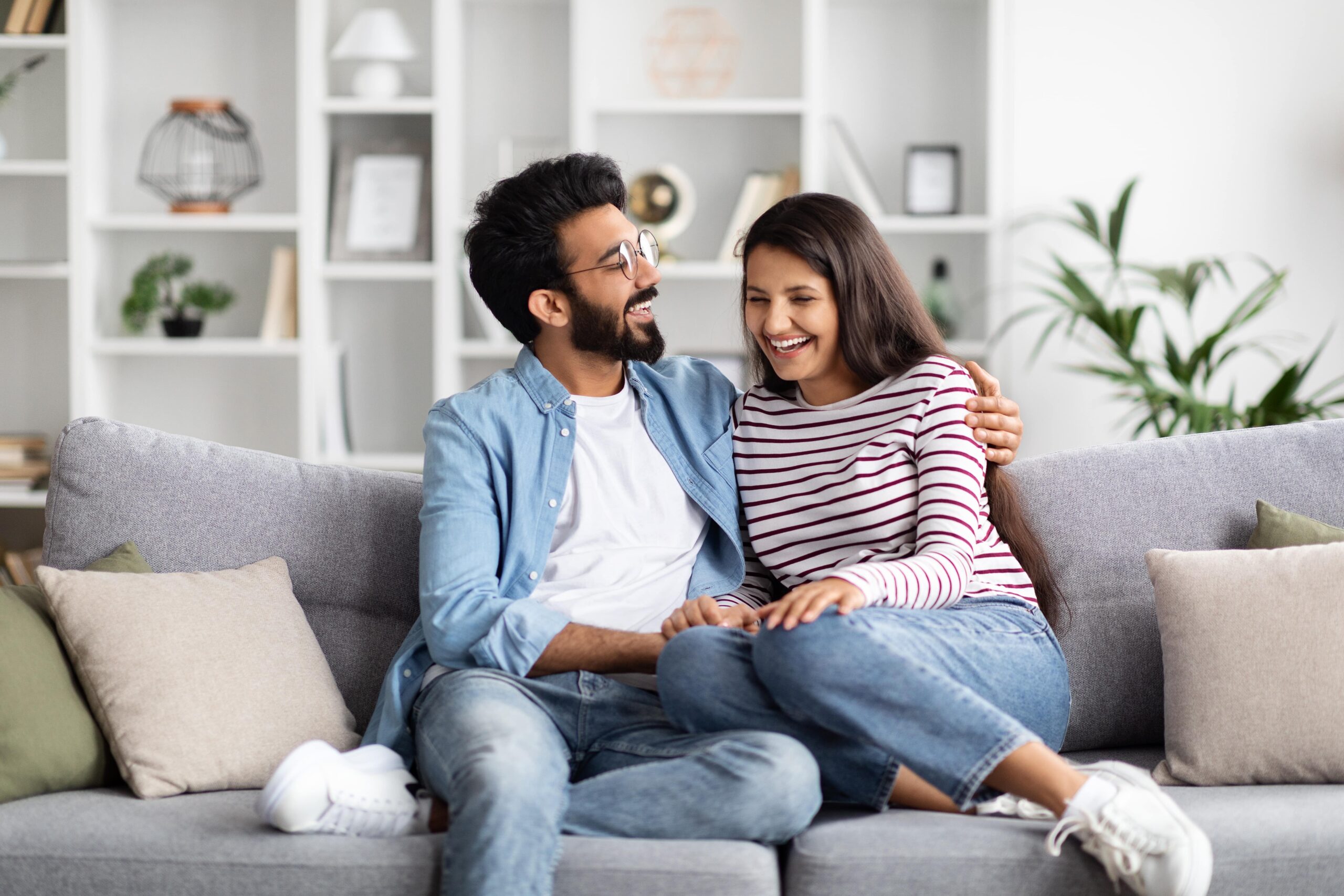 man and woman spending time together at home