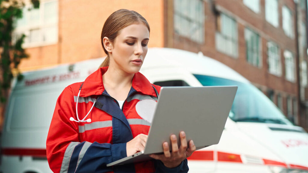 Female Doctor Keeping Medical Records Ambulance