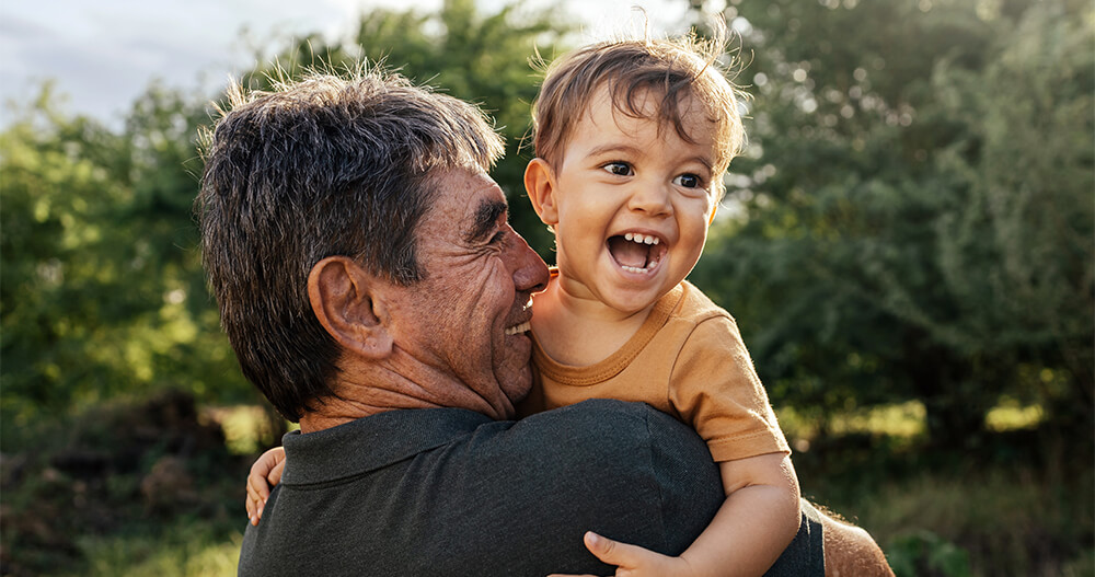 man carrying his child