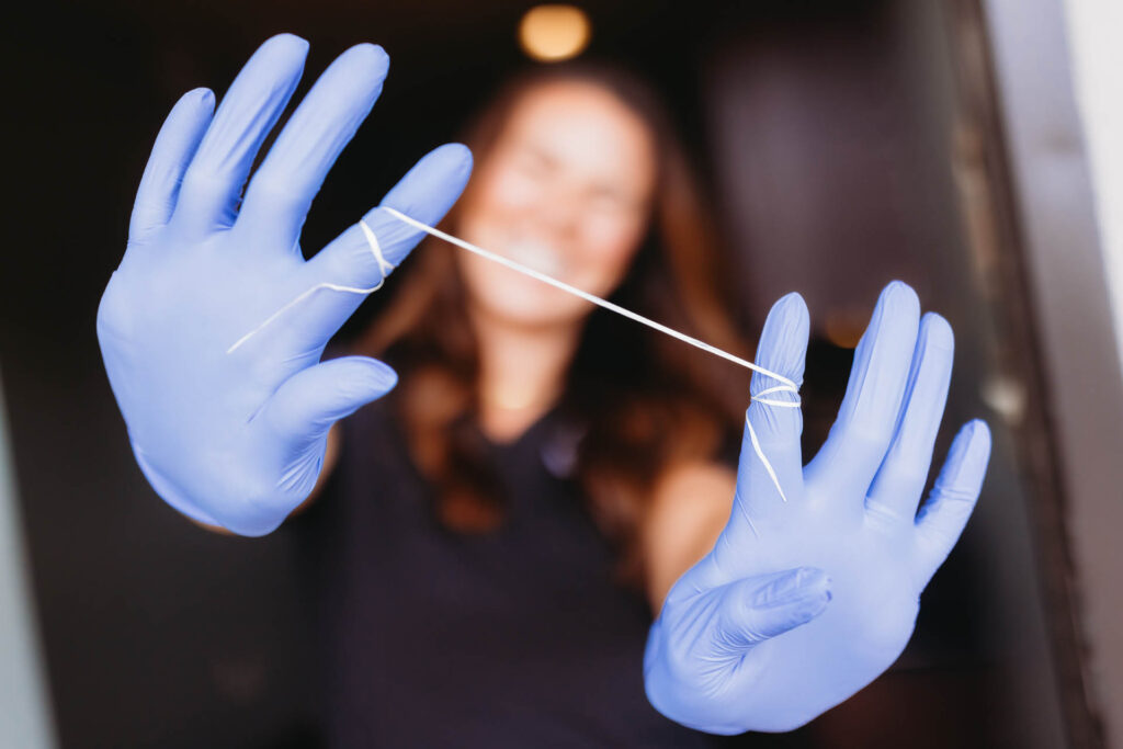 Leah Cook with floss on her hands