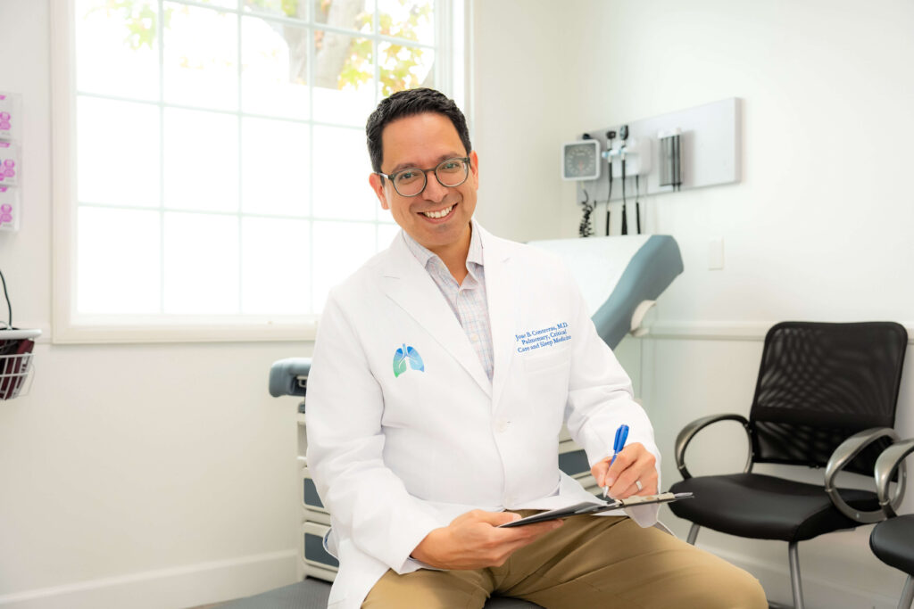 Dr. Jose B. Contreras sitting in the clinic