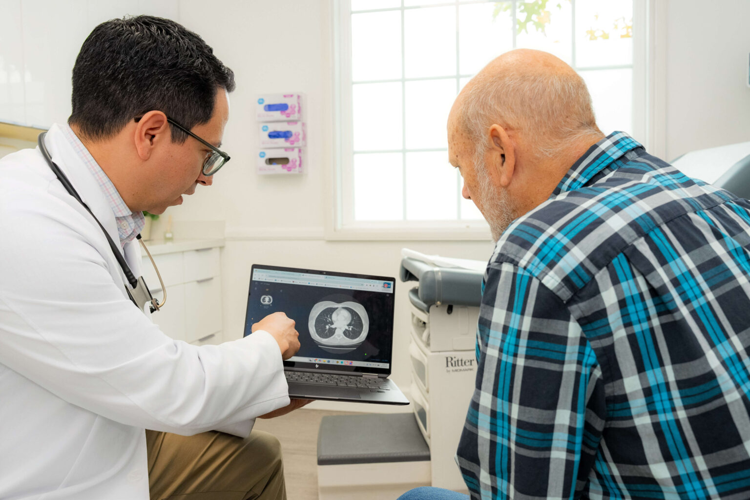 Dr. Jose B. Contreras discussing the results of a computed tomography (CT) scan of the lungs