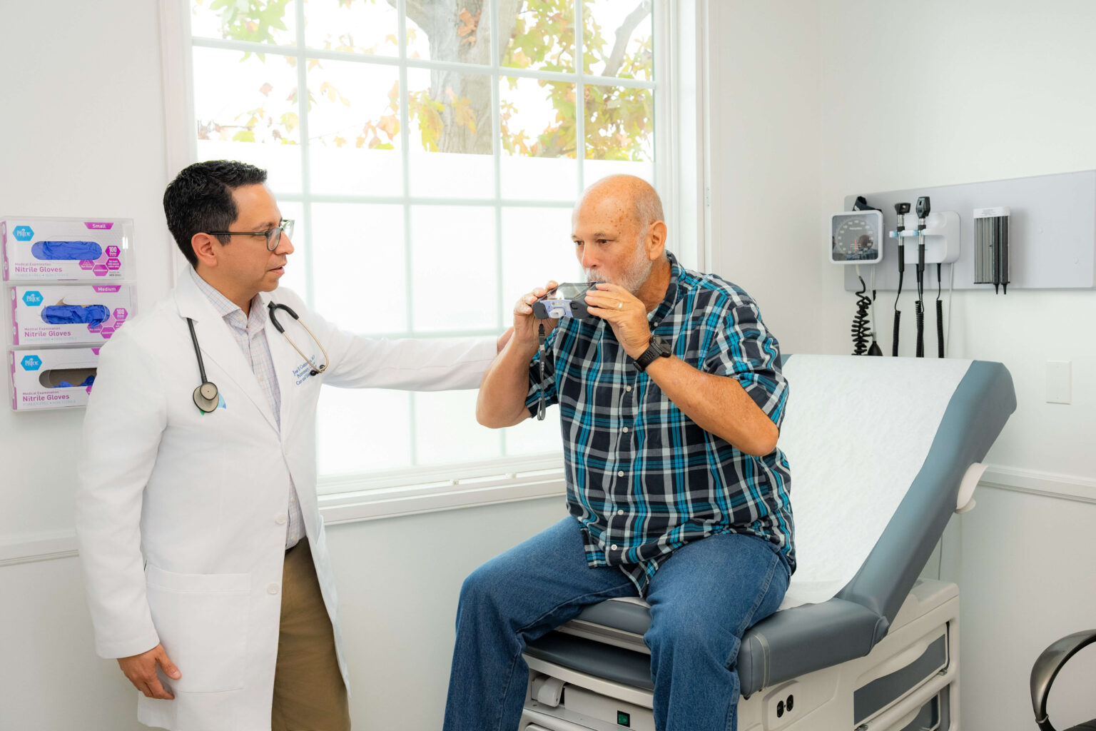 Dr. Jose B. Contreras examining patient