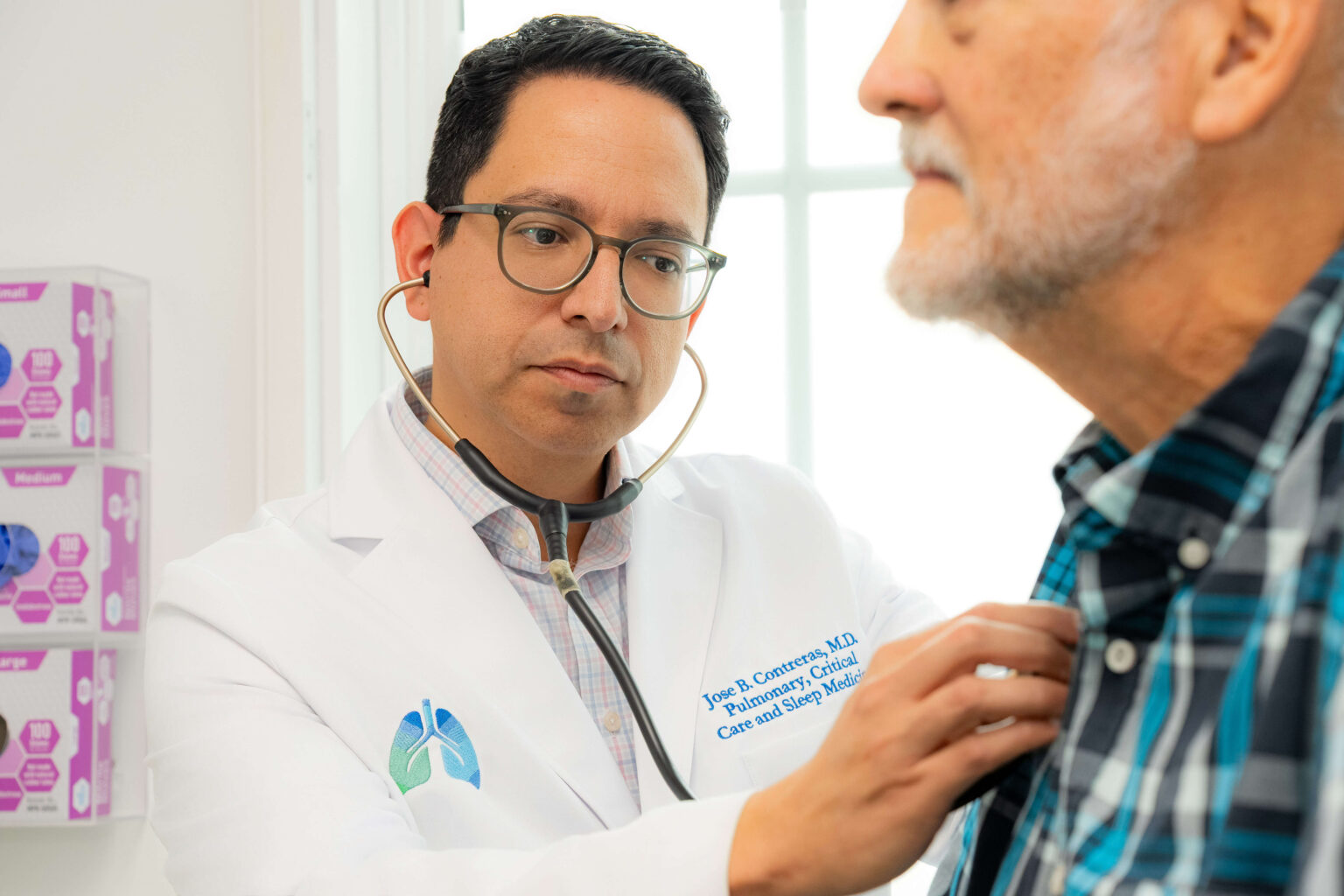 Dr. Jose B. Contreras examining patient