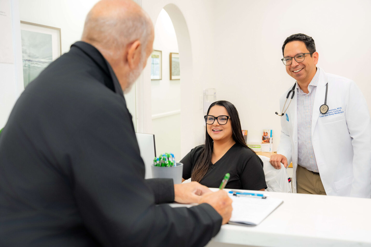 Dr. Jose B. Contreras talking to staff