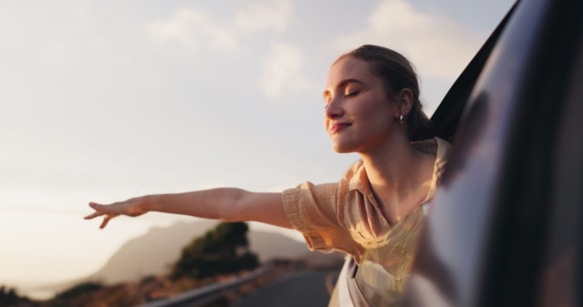 Car, freedom and road trip for woman, fresh air and thinking of ride in nature