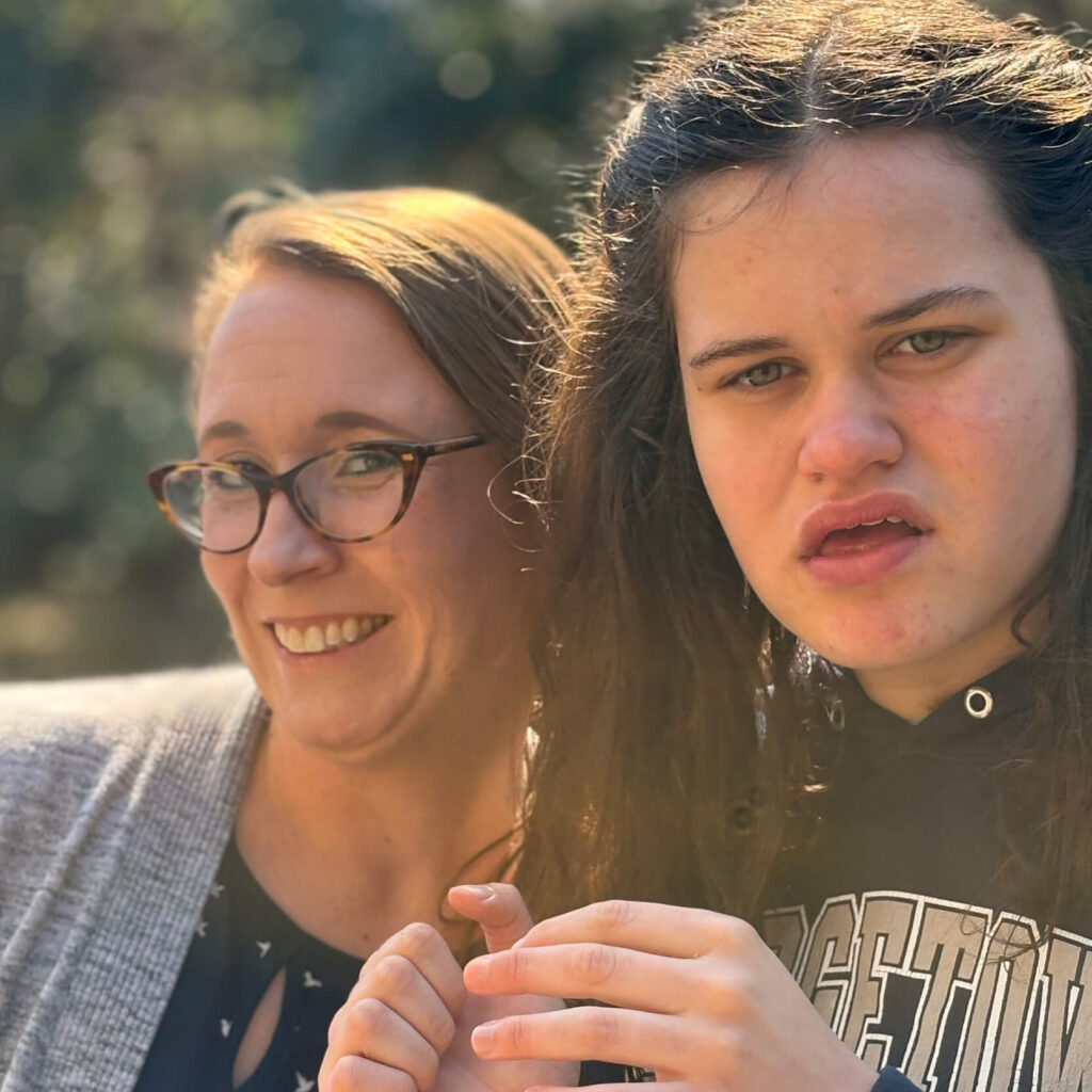 cropped photo of a mother and her autistic daughter