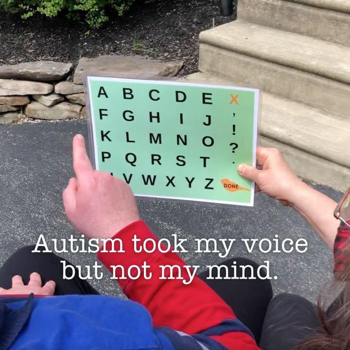 autistic patient pointing to a letterboard