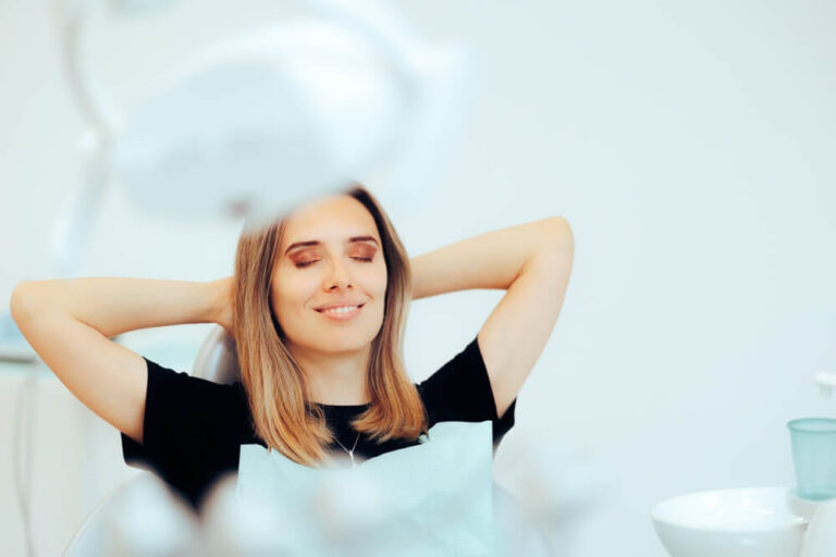 Happy Relaxed Patient Sitting in a Dental office