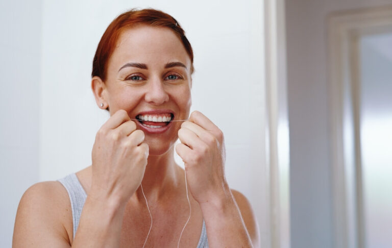 Happy woman, portrait and morning with dental floss for gum care, hygiene or grooming at home
