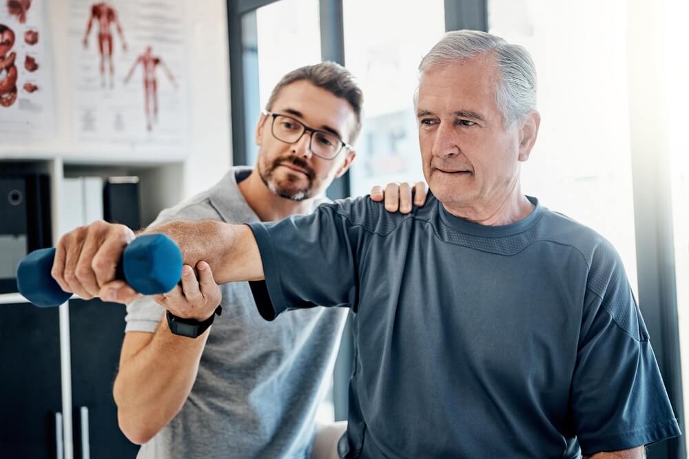 Weight, senior man and physiotherapy with chiropractor