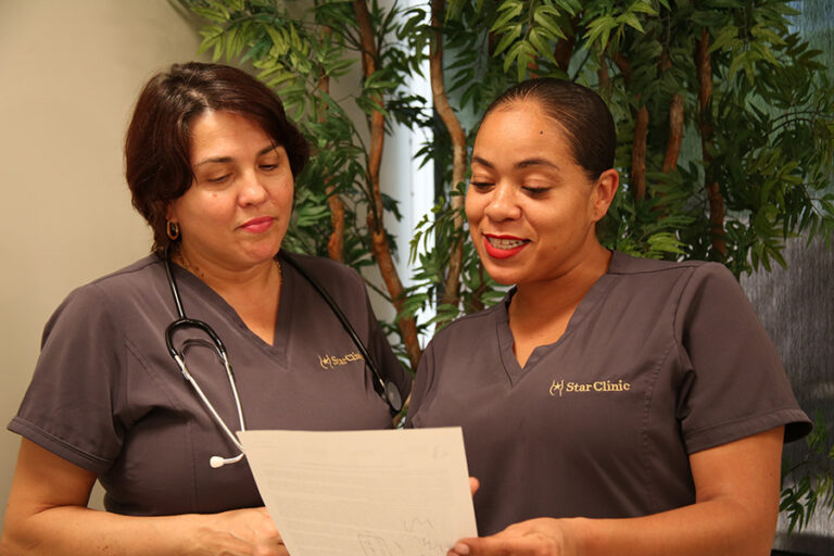 Star Clinic staff reviewing document