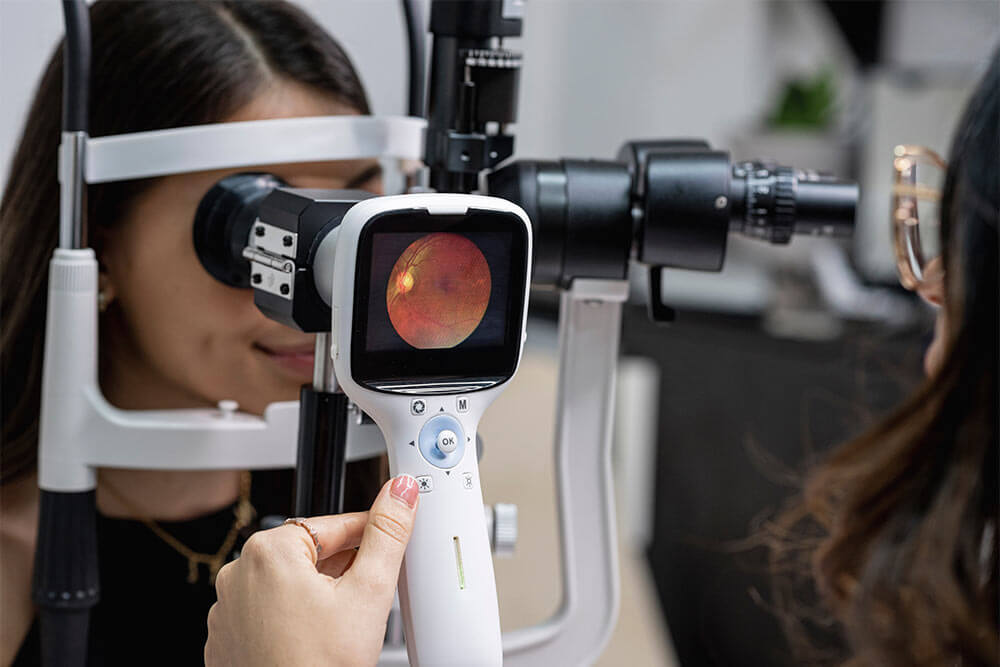Eye doctor performing an eye fundus examination with retinal camera