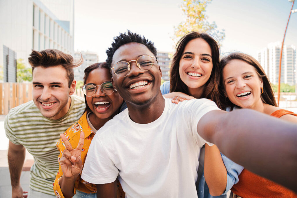 Group of young student smiling and taking a selfie together