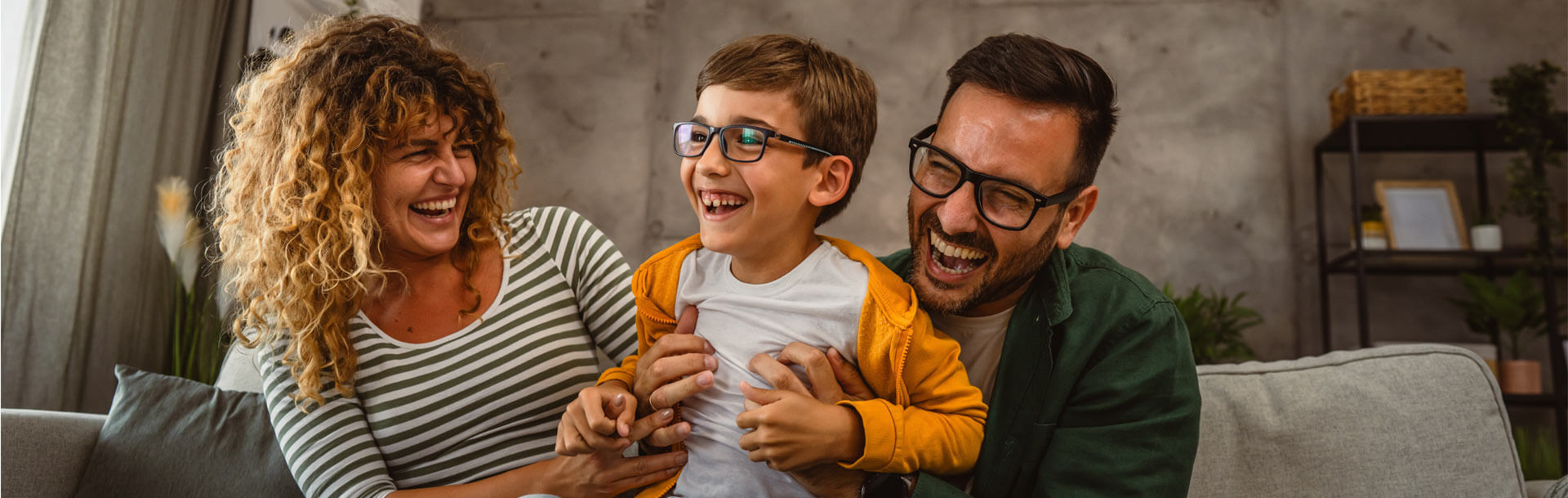 happy family of three have a fun at home