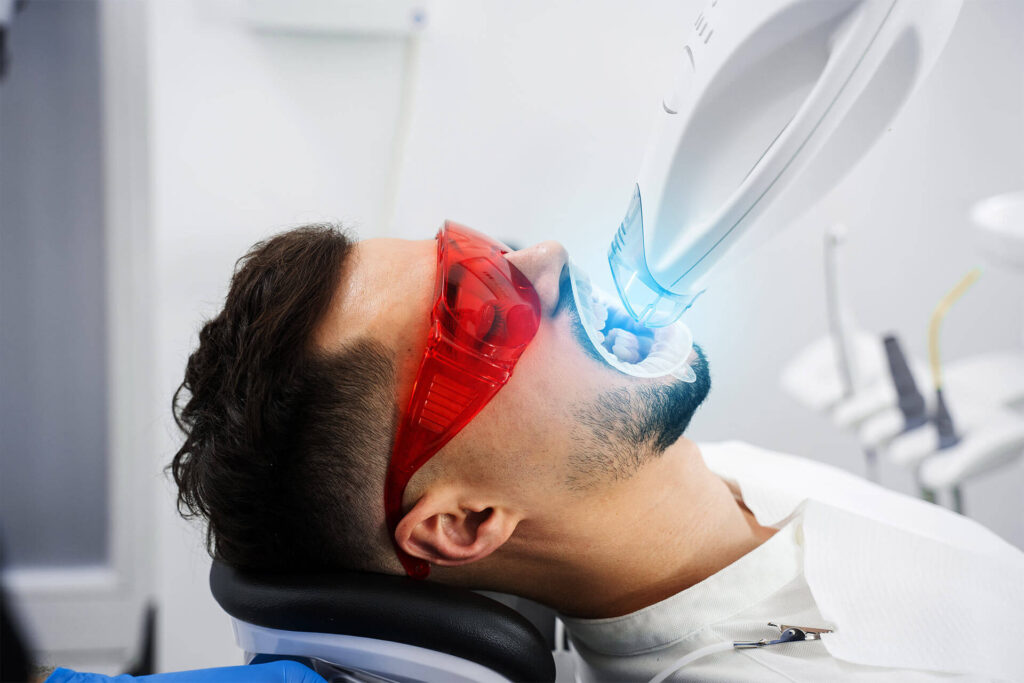 Ultraviolet teeth whitening procedure in dental clinic