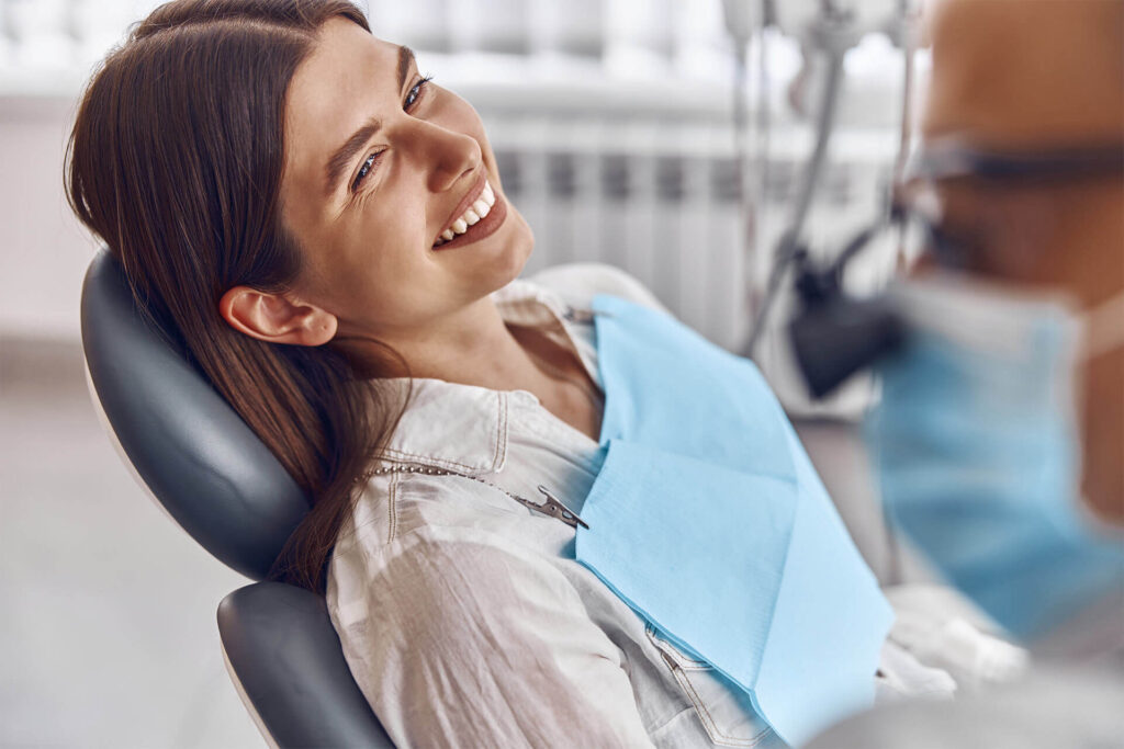 Professional doctor is checking woman's teeth